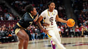 Dec 29, 2024; Columbia, South Carolina, USA; South Carolina Gamecocks forward Ashlyn Watkins (2) drives around Wofford Terriers forward Queen Ikhiuwu (81) in the first half at Colonial Life Arena. Mandatory Credit: Jeff Blake-Imagn Images