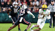 Nov 16, 2024; Columbia, South Carolina, USA; Missouri Tigers wide receiver Theo Wease Jr. (1) runs after a reception against South Carolina Gamecocks defensive back Jalon Kilgore (24) in the second half at Williams-Brice Stadium. Mandatory Credit: Jeff Blake-Imagn Images