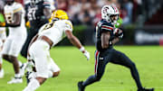 Nov 16, 2024; Columbia, South Carolina, USA; South Carolina Gamecocks wide receiver Mazeo Bennett Jr. (3) runs after a reception as Missouri Tigers safety Daylan Carnell (13) closes in during the second quarter at Williams-Brice Stadium. Mandatory Credit: Jeff Blake-Imagn Images