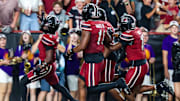 Sep 6, 2025; Columbia, South Carolina, USA; South Carolina Gamecocks defensive back Vicari Swain (4) celebrates his second punt return touchdown against the South Carolina State Bulldogs in the second quarter at Williams-Brice Stadium. Mandatory Credit: Jeff Blake-Imagn Images