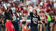 Sep 6, 2025; Columbia, South Carolina, USA; South Carolina Gamecocks head women’s basketball coach Dawn Staley leads the crowd in a cheer before the game against the South Carolina State Bulldogs at Williams-Brice Stadium. Mandatory Credit: Jeff Blake-Imagn Images