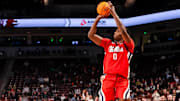 Feb 12, 2025; Columbia, South Carolina, USA; Mississippi Rebels forward Malik Dia (0) attempts a three point basket against the South Carolina Gamecocks in the second half at Colonial Life Arena. Mandatory Credit: Jeff Blake-Imagn Images