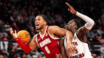 Jan 8, 2025; Columbia, South Carolina, USA; Alabama Crimson Tide guard Chris Youngblood (8) loses the ball as South Carolina Gamecocks guard Morris Ugusuk (15) defends in the second half at Colonial Life Arena. Mandatory Credit: Jeff Blake-Imagn Images