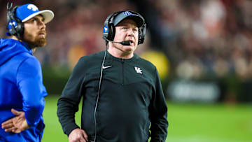 Nov 18, 2023; Columbia, South Carolina, USA; Kentucky Wildcats head coach Mark Stoops directs his team against the South Carolina Gamecocks in the first quarter at Williams-Brice Stadium. Mandatory Credit: Jeff Blake-Imagn Images Kentucky