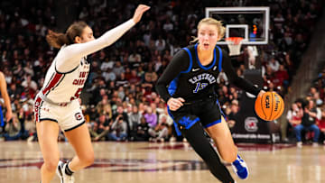Mar 2, 2025; Columbia, South Carolina, USA; Kentucky Wildcats center Clara Strack (13) drives past South Carolina Gamecocks guard Tessa Johnson (5) in the second half at Colonial Life Arena. Mandatory Credit: Jeff Blake-Imagn Images
