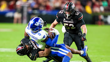 sNov 18, 2023; Columbia, South Carolina, USA; South Carolina Gamecocks defensive back Nick Emmanwori (21) brings down Kentucky Wildcats running back Demie Sumo-Karngbaye (0) in the second half at Williams-Brice Stadium. Mandatory Credit: Jeff Blake-Imagn Images Kentucky