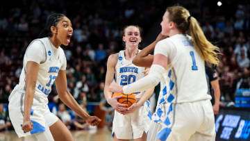 Mar 22, 2024; Columbia, SC, USA; North Carolina Tar Heels guard Lexi Donarski (20), guard Teonni Key (13) and guard Alyssa Ustby (1) celebrate a rebound against the Michigan State Spartans in the second half at Colonial Life Arena. Mandatory Credit: Jeff Blake-USA TODAY Sports