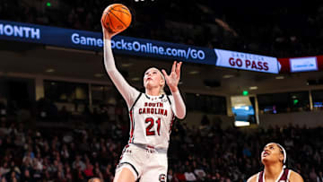Jan 9, 2025; Columbia, South Carolina, USA; South Carolina Gamecocks forward Chloe Kitts (21) drives past Texas A&M Aggies forward Jada Malone (13) in the first half at Colonial Life Arena. Mandatory Credit: Jeff Blake-Imagn Images