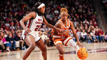 Jan 12, 2025; Columbia, South Carolina, USA; Texas Longhorns guard Bryanna Preston (1) drives around South Carolina Gamecocks guard Raven Johnson (25) in the second half at Colonial Life Arena. Mandatory Credit: Jeff Blake-Imagn Images