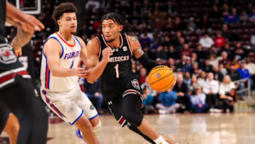 Jan 22, 2025; Columbia, South Carolina, USA; South Carolina Gamecocks guard Jacobi Wright (1) drives around Florida Gators guard Walter Clayton Jr. (1) in the first half at Colonial Life Arena. Mandatory Credit: Jeff Blake-Imagn Images