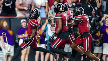 Sep 6, 2025; Columbia, South Carolina, USA; South Carolina Gamecocks defensive back Vicari Swain (4) celebrates his second punt return touchdown against the South Carolina State Bulldogs in the second quarter at Williams-Brice Stadium. Mandatory Credit: Jeff Blake-Imagn Images
