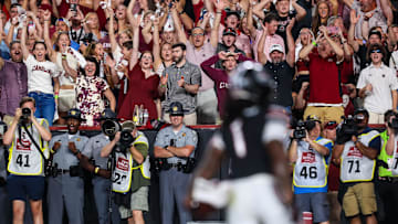 Sep 27, 2025; Columbia, South Carolina, USA; South Carolina Gamecocks fans celebrate a touchdown against the Kentucky Wildcats in the first quarter at Williams-Brice Stadium. Mandatory Credit: Jeff Blake-Imagn Images