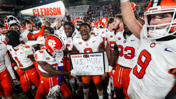 Nov 25, 2023; Columbia, South Carolina, USA; Clemson Tigers linebacker Barrett Carter (0) holds a  We Run this state  sign after defeating the South Carolina Gamecocks at Williams-Brice Stadium. Mandatory Credit: Jeff Blake-USA TODAY Sports