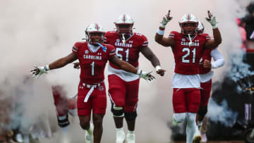 Nov 11, 2023; Columbia, South Carolina, USA; South Carolina Gamecocks defensive back DQ Smith (1), offensive lineman Tree Babalade (51), and defensive back Nick Emmanwori (21) lead their teammates onto the field before a game against the Vanderbilt Commodores at Williams-Brice Stadium. Mandatory Credit: Jeff Blake-USA TODAY Sports