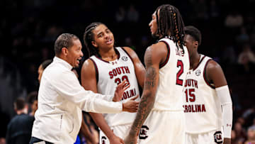 Dec 30, 2024; Columbia, South Carolina, USA; South Carolina Gamecocks head coach Lamont Paris speaks with forward Collin Murray-Boyles (30), guard Zachary Davis (2), and guard Morris Ugusuk (15) against the Presbyterian Blue Hose in the second half at Colonial Life Arena. Mandatory Credit: Jeff Blake-Imagn Images