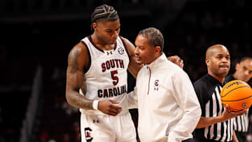 Dec 30, 2024; Columbia, South Carolina, USA; South Carolina Gamecocks head coach Lamont Paris speaks with forward Nick Pringle (5) against the Presbyterian Blue Hose in the second half at Colonial Life Arena. Mandatory Credit: Jeff Blake-Imagn Images