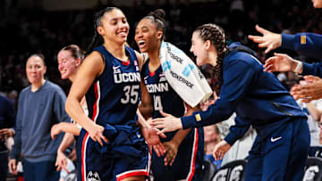 UConn Huskies guard Azzi Fudd is congratulated after being pulled from the game against the South Carolina Gamecocks.