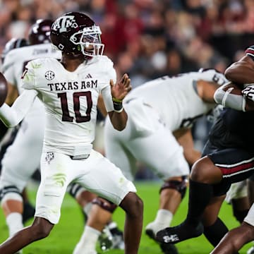 Nov 2, 2024; Columbia, South Carolina, USA; Texas A&M Aggies quarterback Marcel Reed (10) passes against the South Carolina Gamecocks in the second quarter at Williams-Brice Stadium. Mandatory Credit: Jeff Blake-Imagn Images