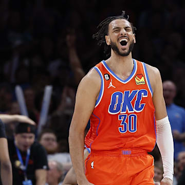 Apr 9, 2023; Oklahoma City, Oklahoma, USA;  Oklahoma City Thunder center Olivier Sarr (30) celebrates during the second half against the Memphis Grizzlies at Paycom Center. Oklahoma City won 115-100. Mandatory Credit: Alonzo Adams-Imagn Images