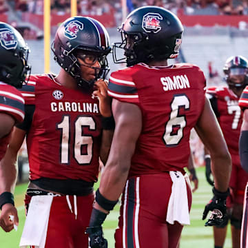 Aug 31, 2024; Columbia, South Carolina, USA; South Carolina Gamecocks quarterback Dante Reno (10), quarterback LaNorris Sellers (16) and tight end Joshua Simon (6) celebrate after a touchdown against the Old Dominion Monarchs in the second half at Williams-Brice Stadium. Mandatory Credit: Jeff Blake-Imagn Images