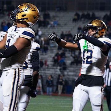 La Salle's JP Oates, 2, celebrates his touchdown against Easton with teammates, Joey O'Brien, 6, Josh Simmons, 8, and Chima Auguste, 12, during the PIAA football quarterfinals in Bethlehem on Nov. 21, 2025.