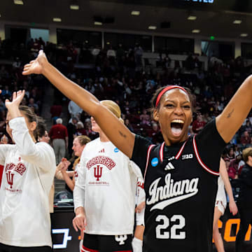 Indiana Hoosiers guard Chloe Moore-McNeil (22) celebrates with teammates following their 76-68 win over the Utah Utes at Colonial Life Arena.