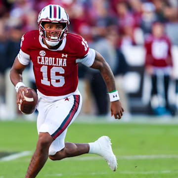 Nov 23, 2024; Columbia, South Carolina, USA; South Carolina Gamecocks quarterback LaNorris Sellers (16) scrambles against the Wofford Terriers in the first quarter at Williams-Brice Stadium. Mandatory Credit: Jeff Blake-Imagn Images