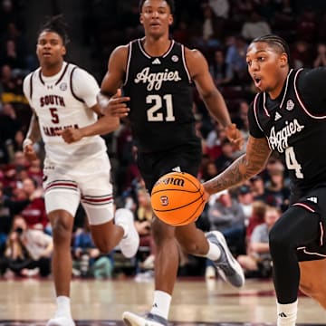 Feb 1, 2025; Columbia, South Carolina, USA; Texas A&M Aggies guard Wade Taylor IV (4) brings the ball up against the South Carolina Gamecocks in the second half at Colonial Life Arena. Mandatory Credit: Jeff Blake-Imagn Images
