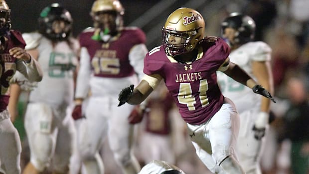 St. Augustine's Kyon Wilcox (41) celebrates after making the tackle on Choctawhatchee Indians' quarterback Jesse Winslette