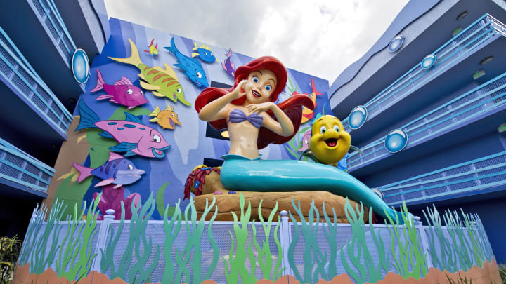 Surrounded by Flounder and friends, a larger-than-life Ariel overlooks "The Little Mermaid"