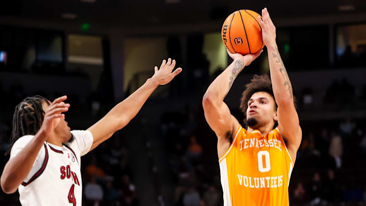 Mar 3, 2026; Columbia, South Carolina, USA; Tennessee Volunteers guard Ja'kobi Gillespie (0) shoots over South Carolina Gamecocks guard Kobe Knox (4) in the second half at Colonial Life Arena. Mandatory Credit: Jeff Blake-Imagn Images