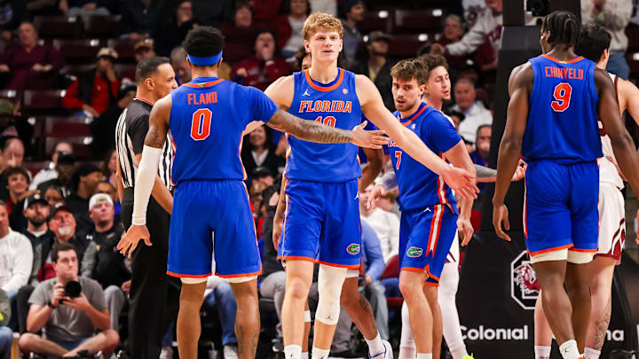 Jan 28, 2026; Columbia, South Carolina, USA; Florida Gators forward Thomas Haugh (10) and guard Boogie Fland (0) celebrate a play against the South Carolina Gamecocks in the first half at Colonial Life Arena. Mandatory Credit: Jeff Blake-Imagn Images