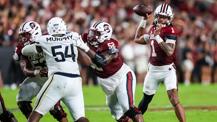 South Carolina football quarterback Robby Ashford attempting a pass against Akron