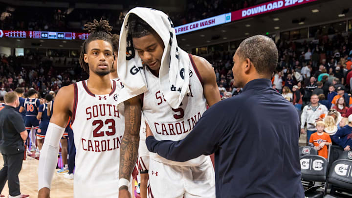 Jan 11, 2025; Columbia, South Carolina, USA; South Carolina Gamecocks head coach Lamont Paris embraces forward Nick Pringle (5) following their loss to the Auburn Tigers at Colonial Life Arena. Pringle missed two free throws down one point with nine seconds left in the game. Mandatory Credit: Jeff Blake-Imagn Images