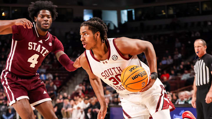 Jan 25, 2025; Columbia, South Carolina, USA; South Carolina Gamecocks forward Collin Murray-Boyles (30) drives past Mississippi State Bulldogs forward Cameron Matthews (4) in the first half at Colonial Life Arena. Mandatory Credit: Jeff Blake-Imagn Images