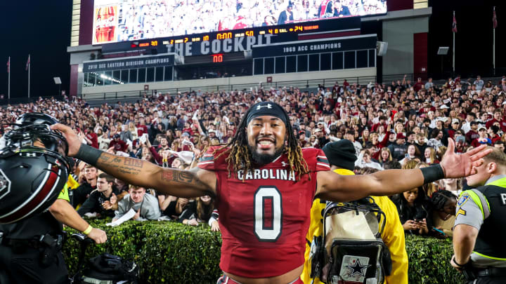 Oct 22, 2022; Columbia, South Carolina, USA; South Carolina Gamecocks linebacker Debo Williams (0) celebrates with students following their win over Texas A&M Aggies at Williams-Brice Stadium. 