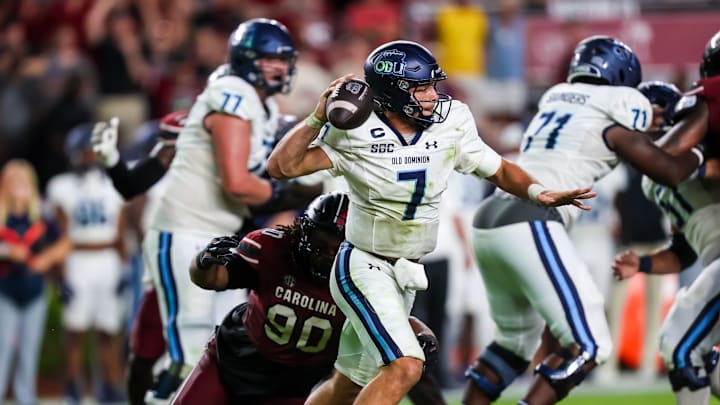 Aug 31, 2024; Columbia, South Carolina, USA; Old Dominion Monarchs quarterback Grant Wilson (7) throws under pressure from South Carolina Gamecocks defensive tackle DeAndre Jules (99) in the second half at Williams-Brice Stadium. Mandatory Credit: Jeff Blake-Imagn Images