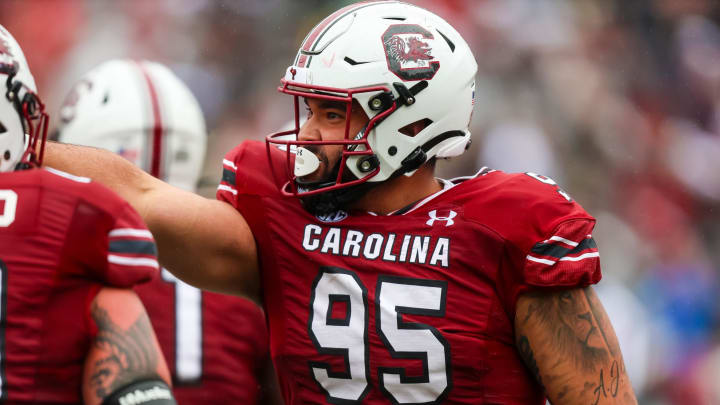 Nov 11, 2023; Columbia, South Carolina, USA; South Carolina Gamecocks defensive tackle Alex Huntley (95) celebrates after making a touchdown reception on offense against the Vanderbilt Commodores in the first quarter at Williams-Brice Stadium. Mandatory Credit: Jeff Blake-USA TODAY Sports