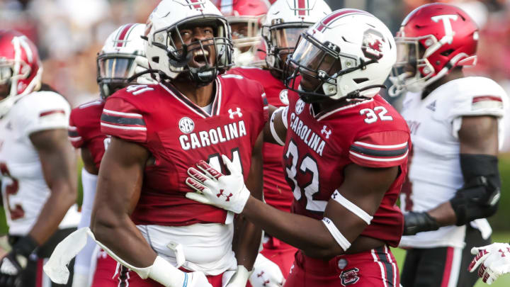 Oct 2, 2021; Columbia, South Carolina, USA; South Carolina Gamecocks linebackers Darryle Ware (41) and Mohamed Kaba (32) celebrate a play against the Troy Trojans in the second half at Williams-Brice Stadium. Mandatory Credit: Jeff Blake-USA TODAY Sports