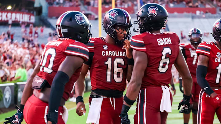 Aug 31, 2024; Columbia, South Carolina, USA; South Carolina Gamecocks quarterback Dante Reno (10), quarterback LaNorris Sellers (16) and tight end Joshua Simon (6) celebrate after a touchdown against the Old Dominion Monarchs in the second half at Williams-Brice Stadium. Mandatory Credit: Jeff Blake-Imagn Images