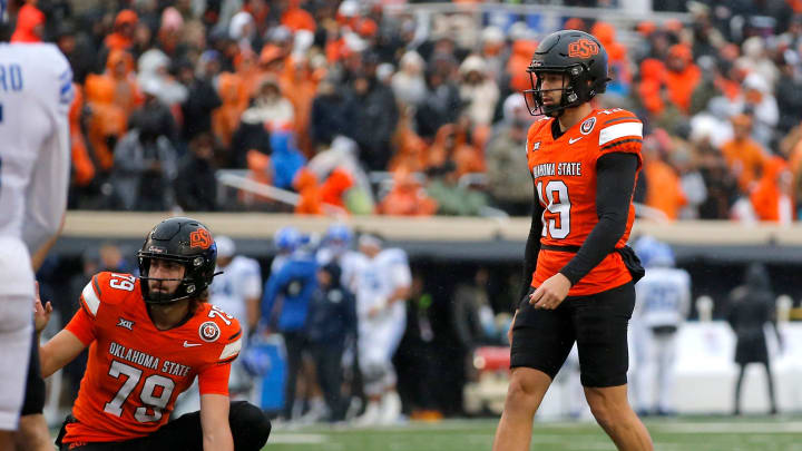 Oklahoma State's Alex Hale (19) prepares to kick a field goal in the first half of the college football game between the Oklahoma State University Cowboys and the Brigham Young Cougars at Boone Pickens Stadium in Stillwater, Okla., Saturday, Nov. 25, 2023.