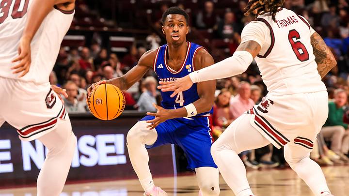 Dec 30, 2024; Columbia, South Carolina, USA; Presbyterian Blue Hose guard Kory Mincy (4) drives against the South Carolina Gamecocks in the second half at Colonial Life Arena. Mandatory Credit: Jeff Blake-Imagn Images