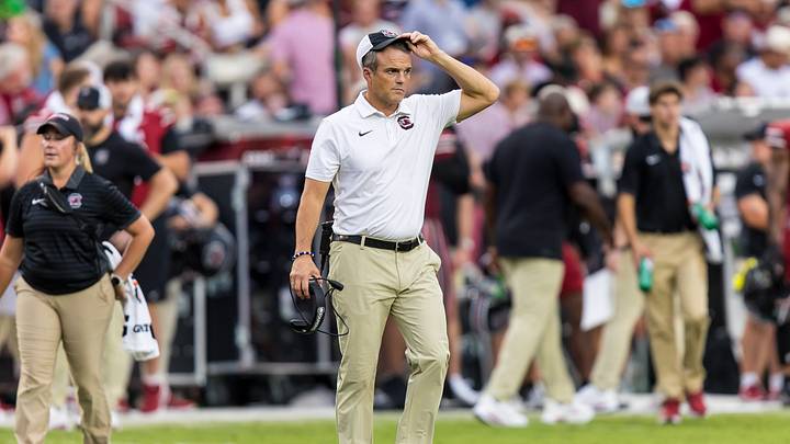 Sep 19, 2026; Columbia, South Carolina, USA;  South Carolina Gamecocks head coach Shane Beamer checks on an injured player against the Mississippi State Bulldogs in the second quarter at Williams-Brice Stadium.  Mandatory Credit: Jeff Blake-Imagn Images