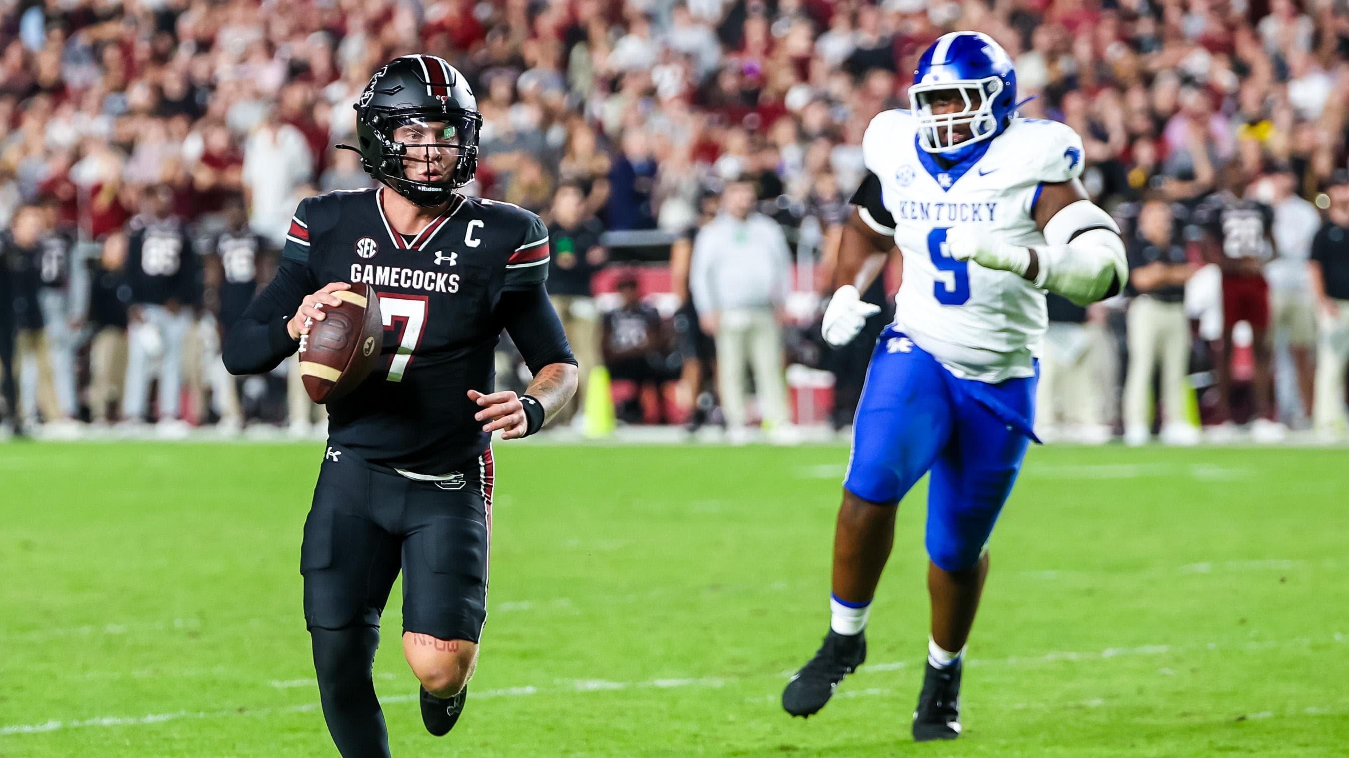 Nov 18, 2023; Columbia, South Carolina, USA; South Carolina Gamecocks’ Spencer Rattler runs away from a Kentucky defender.