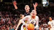 Mar 23, 2025; Columbia, South Carolina, USA; South Carolina Gamecocks forward Chloe Kitts (21) drives around Indiana Hoosiers forward Lilly Meister (52) in the first half at Colonial Life Arena. Mandatory Credit: Jeff Blake-Imagn Images