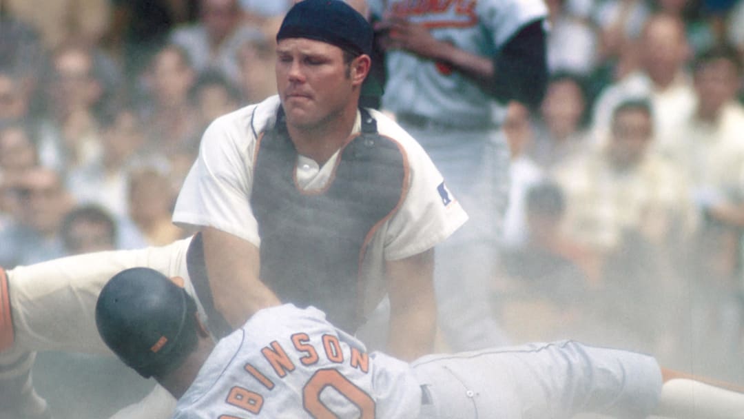 Jun 1969; Detroit, MI, USA; FILE PHOTO; Detroit Tigers catcher BILL FREEHAN in a play at the plate against Baltimore Orioles outfielder FRANK ROBINSON at Tiger Stadium during the 1969 season. 