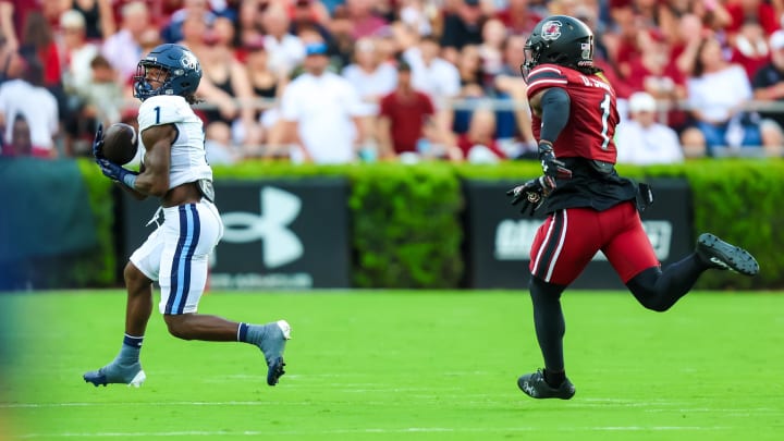 Aug 31, 2024; Columbia, South Carolina, USA; Old Dominion Monarchs wide receiver Isiah Paige (1) makes a reception for a touchdown against South Carolina Gamecocks defensive back DQ Smith (1) in the first half at Williams-Brice Stadium. Mandatory Credit: Jeff Blake-USA TODAY Sports