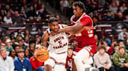 Jan 8, 2025; Columbia, South Carolina, USA; South Carolina Gamecocks forward Nick Pringle (5) drives around Alabama Crimson Tide forward Aiden Sherrell (22) in the first half at Colonial Life Arena. Mandatory Credit: Jeff Blake-Imagn Images