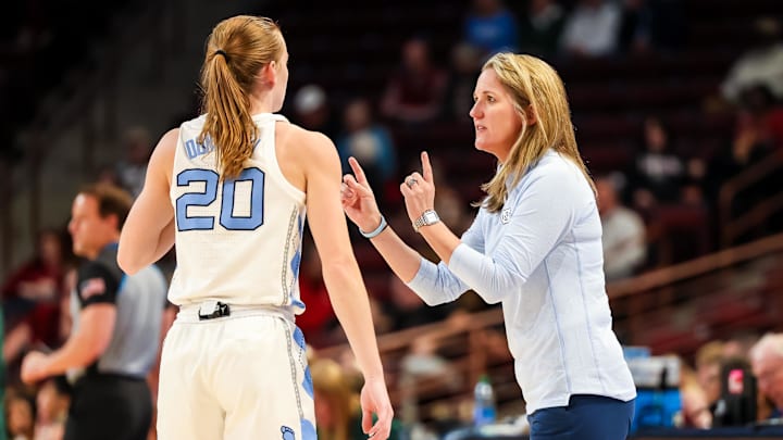 Mar 22, 2024; Columbia, SC, USA; North Carolina Tar Heels head coach Courtney Banghart speaks with guard Lexi Donarski (20) in the first half at Colonial Life Arena. Mandatory Credit: Jeff Blake-Imagn Images