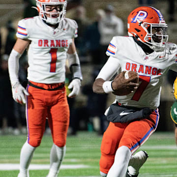 Olentangy Orange quarterback Levi Davis runs the ball in the Pioneers' 28-0 win over Lakewood St. Edward in the Division I state semifinal game Friday night, Nov. 28, 2025, at Arlin Field in Mansfield.